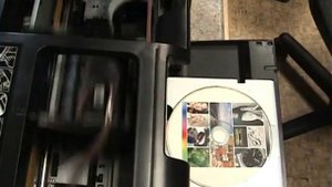 Принтер-автомат для печати на CD\DVD дисках.