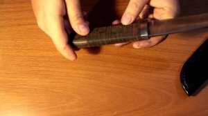 Наборная рукоять из кожи.