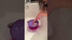 Mia opening Pearl Surprise. Bath Bomb