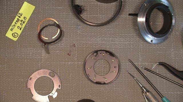 Oil on the aperture blades In Nikon Lens Series E 100mm 1:2.8 смотреть онлайн
