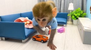Monkey Baby Bon Bon doing shopping in Car Toy store and eat Kinder Joy Egg chocolate with puppy
