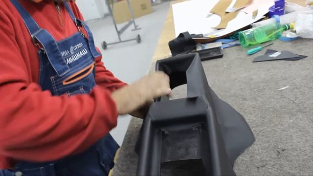 Перетяжка консоли кожей