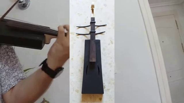 N2   Скрипка из пластика, корпус изготовлен из старого телевизора.