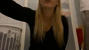 Young blonde smokes a cigarette