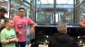 Flashmob Chanting  'Don't Bash The Piano' at a Pianist