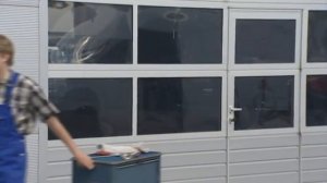 Секционные ворота с калиткой без порога от Hormann.