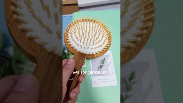 A large bamboo wood paddle hair brush good for tangled hair