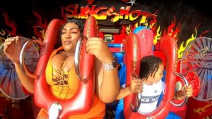 Big Breasts women ride rollercoaster.