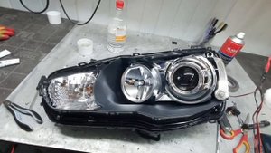 Mitsubishi Lancer. Установка топовых линз BI-LED Aozoom A4+ под завод и скрытая установка.
