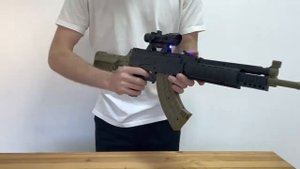 Игрушечное оружие. Детский автомат с  лазерным прицелом и пульками. AK 13