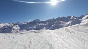 Skiing 'cyclamen' red piste in Tignes Val d'Isere.