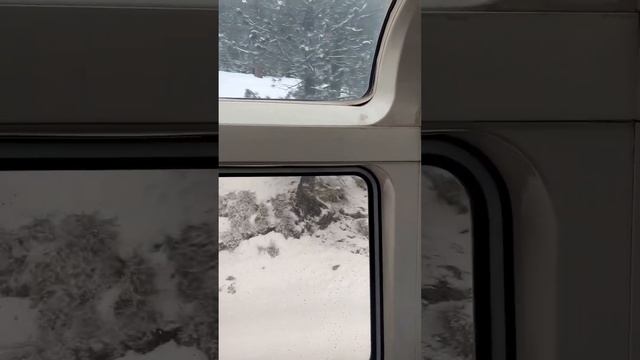 Majestic view of snow-covered Sierra Nevada mountains aboard Amtrak’s California Zephyr.