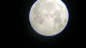 Full blue moon on Halloween through telescope, 20mm lense