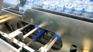 Групповая упаковка ПЭТ бутылок в термоусадочную плёнку и гофрокороб