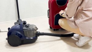 How to vacuum a travel suitcase? Girl in shirt vacuuming with Bosch BGS21X320. clean with me