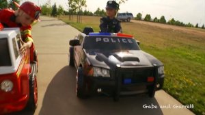 Power Wheels Race - Policeman (Sidewalk Cop) vs Fireman!