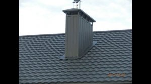 Кровля из модульной металлочерепицы в черном цвете