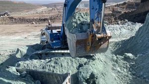 Caterpillar 345C Excavator Loading Trucks