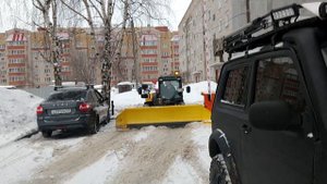 Телескопический погрузчик JCB со снегоуборочным отвалом