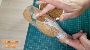 Декор бутылки гречкой и яичной скорлупой.