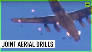 Syrian and Russian paratroopers fly in joint drill