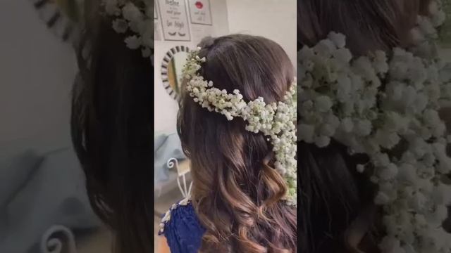 open hairstyle with artificial flowers l bridal hairstyle with artificial flowers