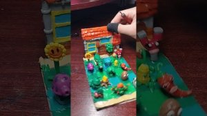 Диорама из пластилина "зомби против растений"