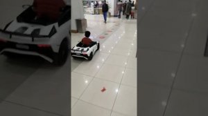 Adam's drive Ferrari in shopping mall