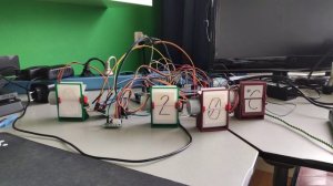 3d printed split flap clock showing time and temperature