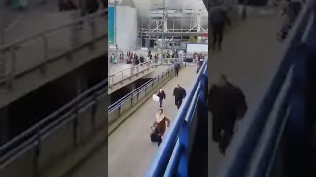 People running out of airport after blast at Belgium Brussels airport