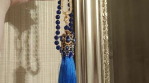 A long necklace with a brush. Jewelry Review