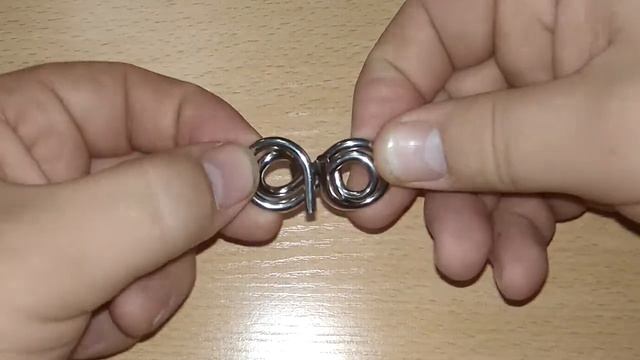 Решение головоломки №5. "Две восьмерки". Проволочные головоломки.