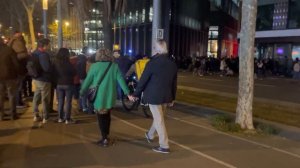 Night walk at crowded Avinguda Diagonal Barcelona Spain