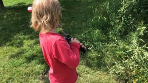 Fishing for the first time, 4-year-old boy casts out a new fishing reel that works great with bobbe