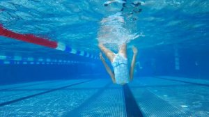 Carla underwater doing underwater gymnastics