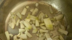 Cabbage stewed with chicken in a frying pan