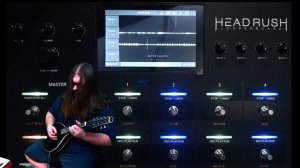 Headrush Looperboard with mandolin, Beatbuddy, Line 6 Helix, and Volca FM.