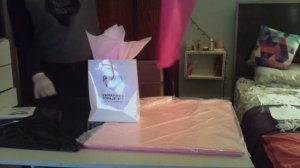 How to properly stuff tissue paper into a gift bag for a corporate event.