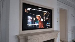 Телевизор над камином