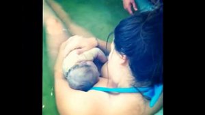 Unassisted home water birth of Lotus. 11 lbs!
