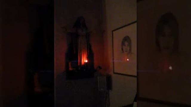 Flicker Flame before the Sacred Heart of Jesus statue.