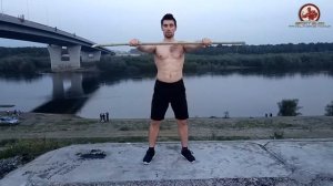Сгибание локтей с палкой в руках