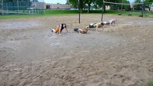 Detroit Slaughter Boot Camp class pushup exercise in the mud