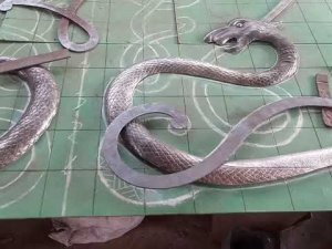 Ковка завитка из полосы 30х4мм с окончанием кулачок