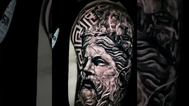 Hyperrealistic black and grey Zeus tattoo