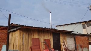 Установил новые 120 трубы на печь в гараже.