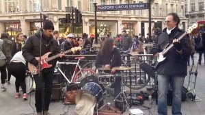 Street band FunFiction outside Oxford Circus stn, London - singing Rolling Stone's Under My Thumb