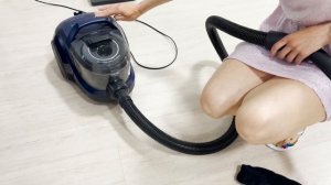 What is the Bosch BGS21X320 vacuum cleaner capable of. Girl in a dress vacuums socks, tights