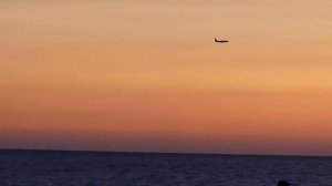 Адлер, закат, самолет над морем