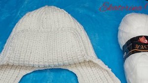 Тёплая шапка - ушанка ( женская), связана на двух спицах.